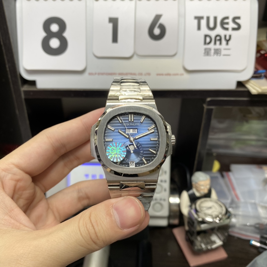 Patek Philippe Nautilus series 57261A-014, Blue Dial Steel Bracelet, Moon Phase Calendar Central Month and Week Display, 40.5mm Size.