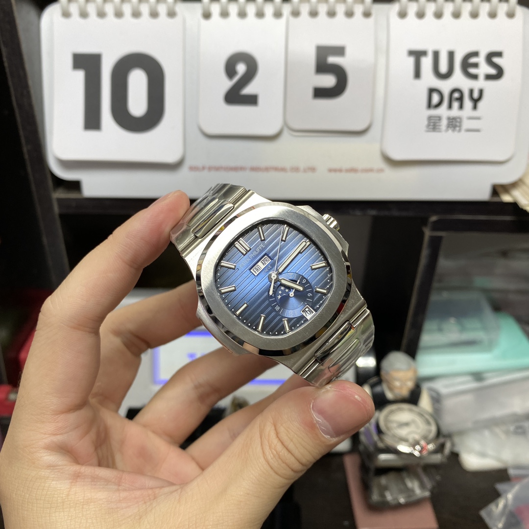 Patek Philippe Nautilus series 57261A-014, Blue Dial Steel Bracelet, Moon Phase Calendar Central Month and Week Display, 40.5mm Size.