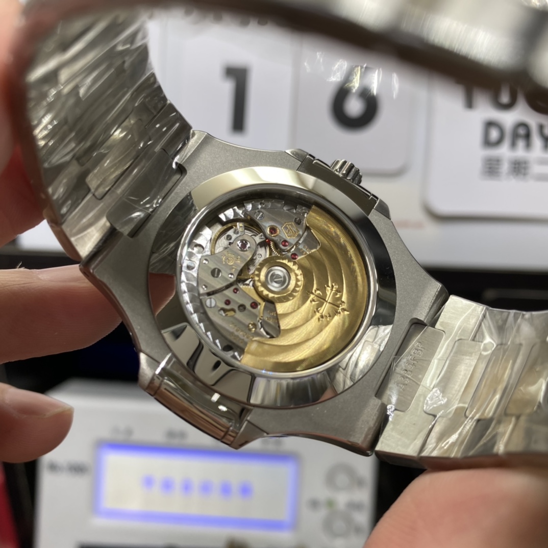 Patek Philippe Nautilus series 57261A-014, Blue Dial Steel Bracelet, Moon Phase Calendar Central Month and Week Display, 40.5mm Size.