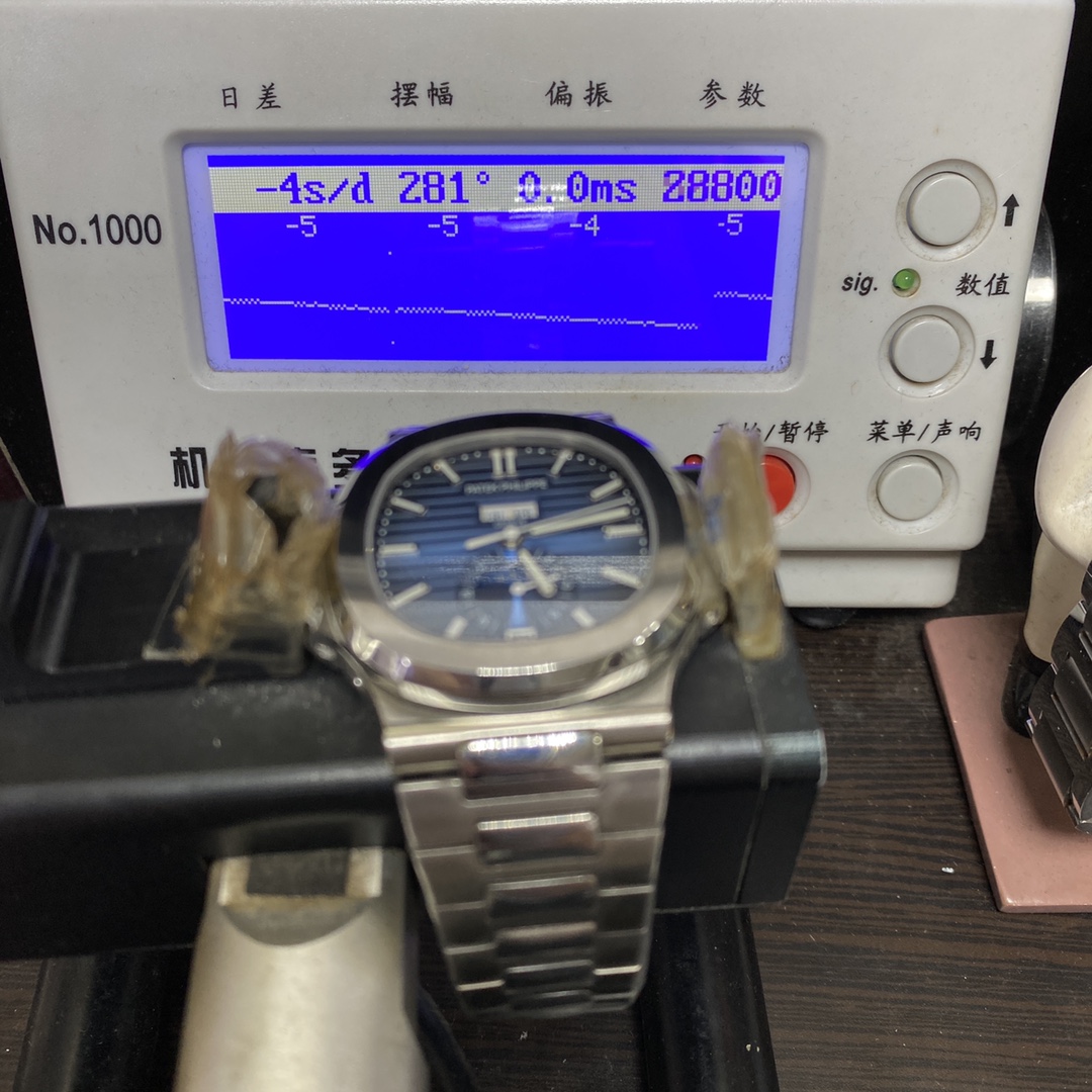 Patek Philippe Nautilus series 57261A-014, Blue Dial Steel Bracelet, Moon Phase Calendar Central Month and Week Display, 40.5mm Size.