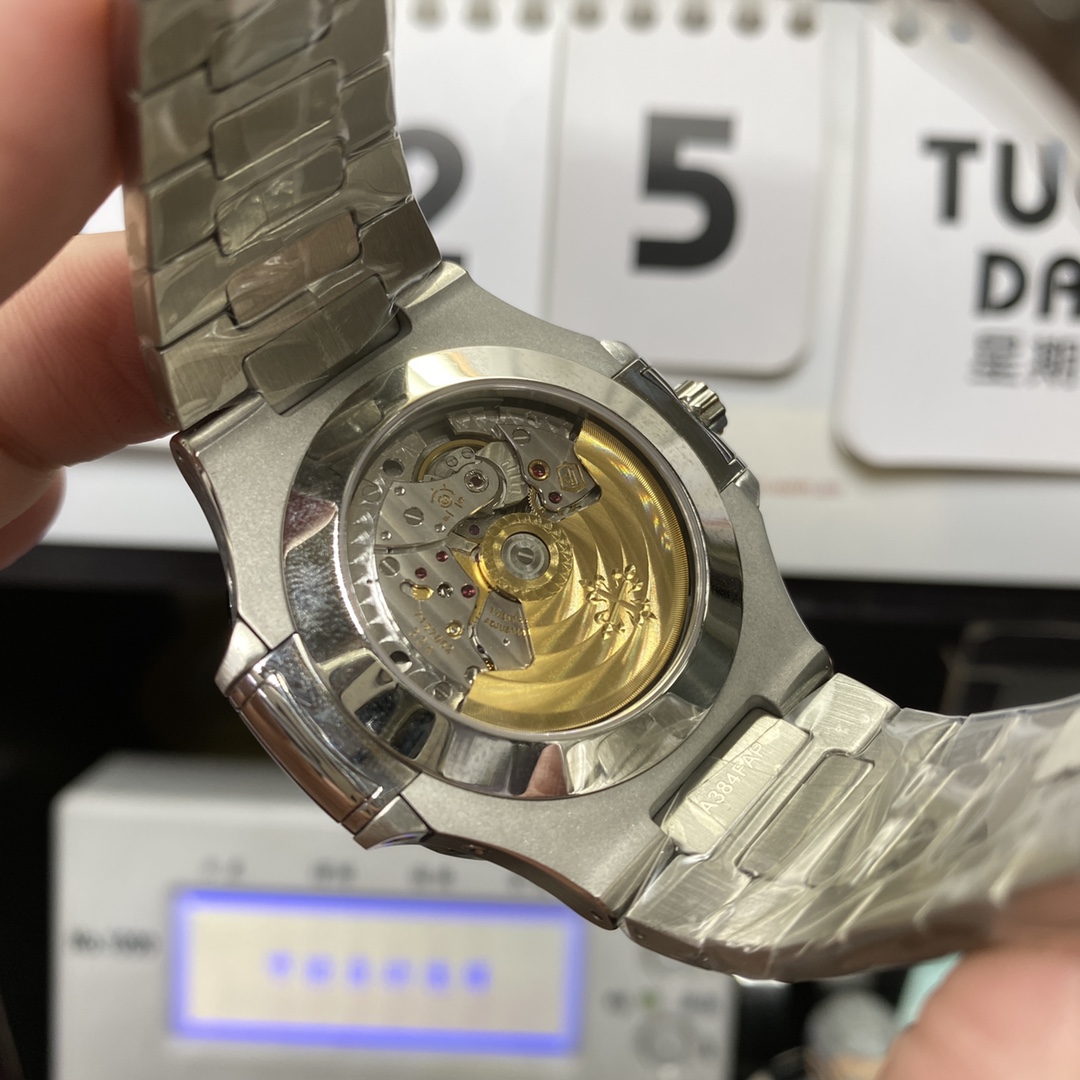 Patek Philippe Nautilus series 57261A-014, Blue Dial Steel Bracelet, Moon Phase Calendar Central Month and Week Display, 40.5mm Size.