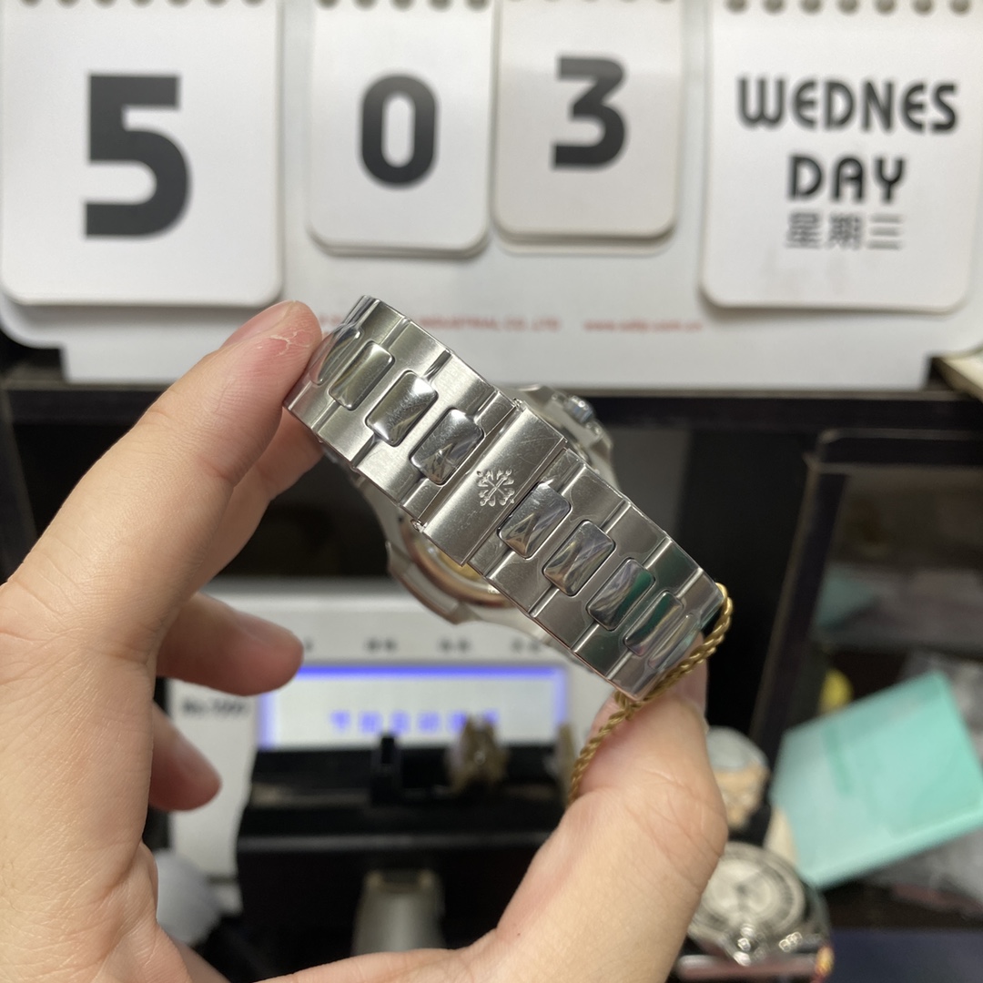 Patek Philippe Nautilus series 57121A-001, Blue Dial Steel Bracelet, Synchronized Functions, 40mm size.